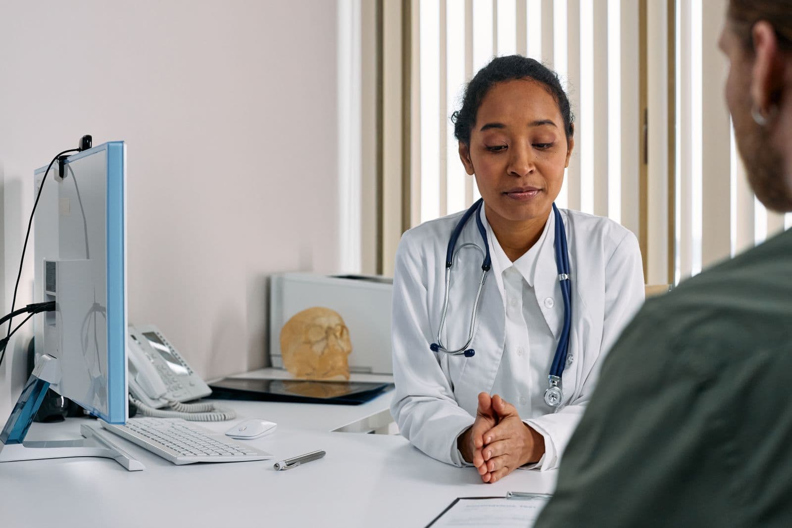 Doctor listening to a patient during a consultation