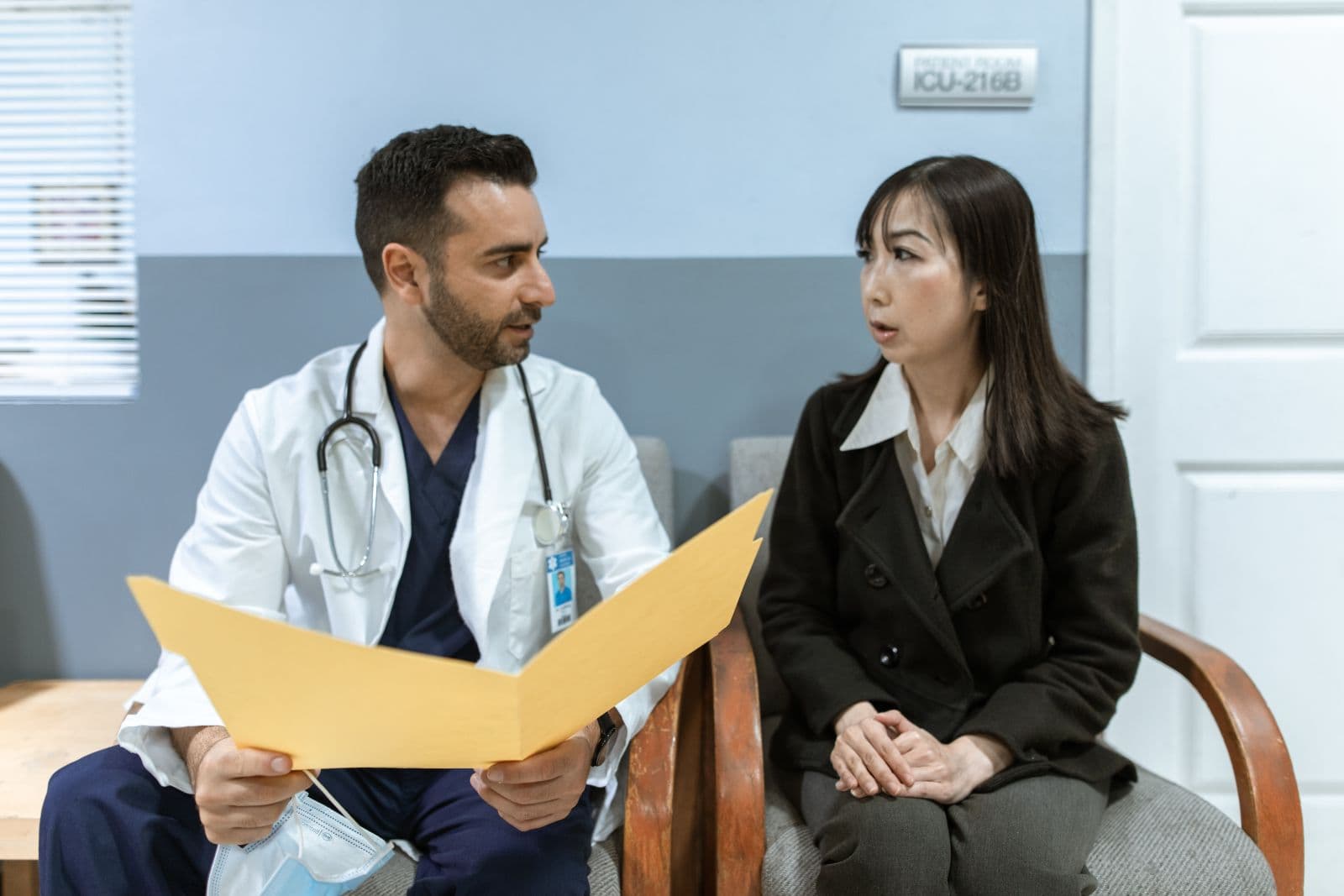 Doctor explaining a report to a patient in a clinic